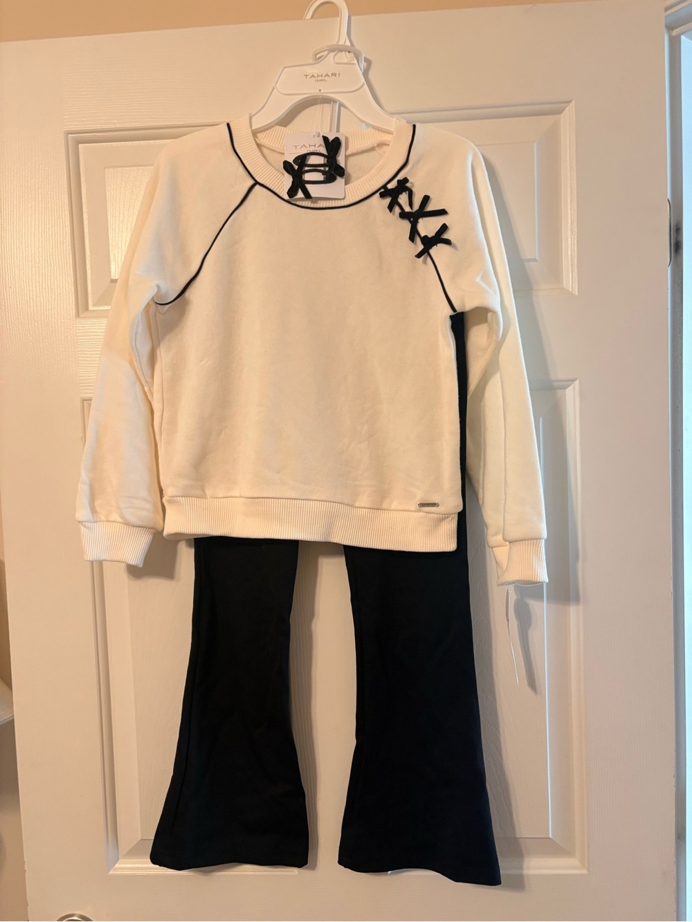 Tahari White & Black Kids Two-Piece Sweater and Flared Joggers Set and hair clip